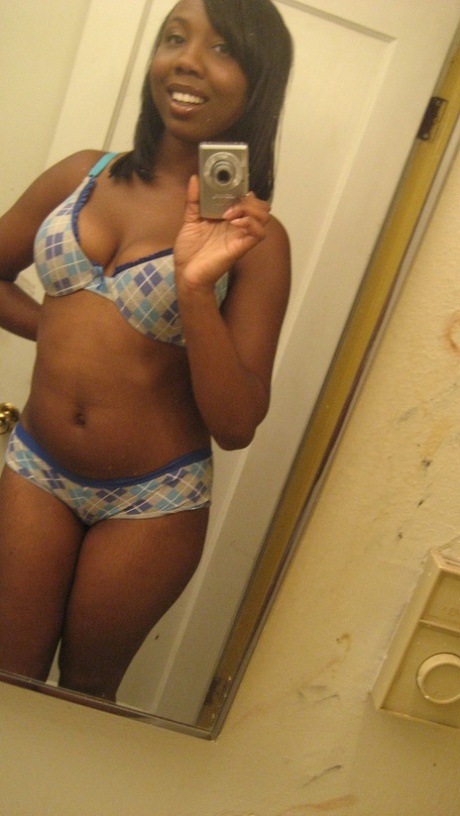 Amateur ebony teen Elisha strips and poses naked in front of the mirror
