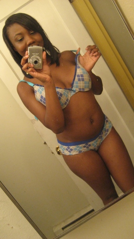 Amateur ebony teen Elisha strips and poses naked in front of the mirror