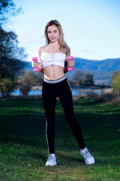 Fit beauty Monika Jelolt strips after her workout and spreads her pussy
