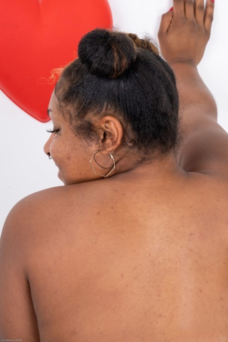 Chubby black babe Daisy shows off her hairy pussy and her great ass
