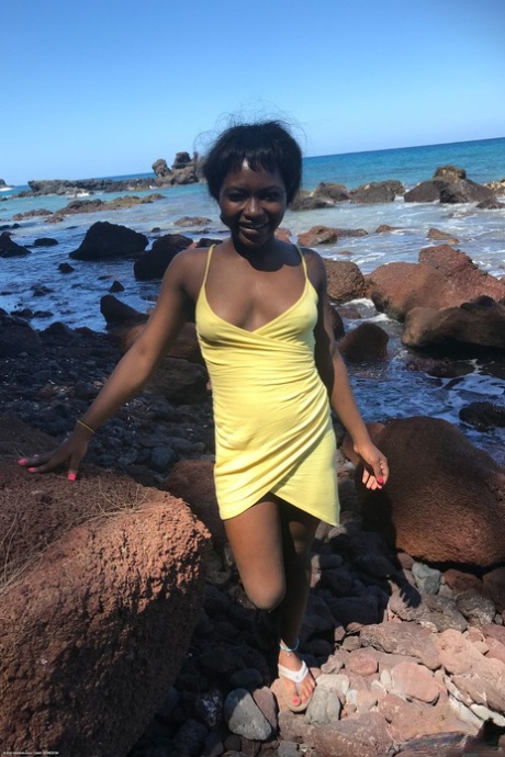 Little Afro-American teen Noemie Bilas shows her tits & choco holes in a solo