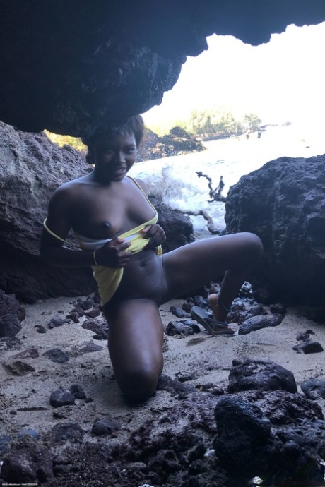 Little Afro-American teen Noemie Bilas shows her tits & choco holes in a solo
