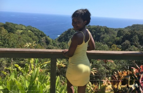 Petite ebony Noemie Bilas exposing her tits, pussy and feet in a solo