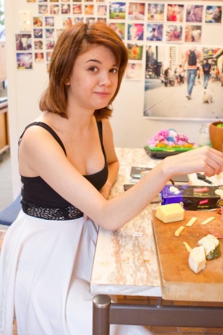 Sexy amateur Lily Rei unveils her small tits and her shaved pussy
