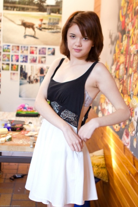 Sexy amateur Lily Rei unveils her small tits and her shaved pussy