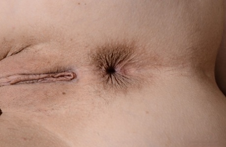 Exotic teen Rina Ellis shows her shaved vagina and teases on a chair