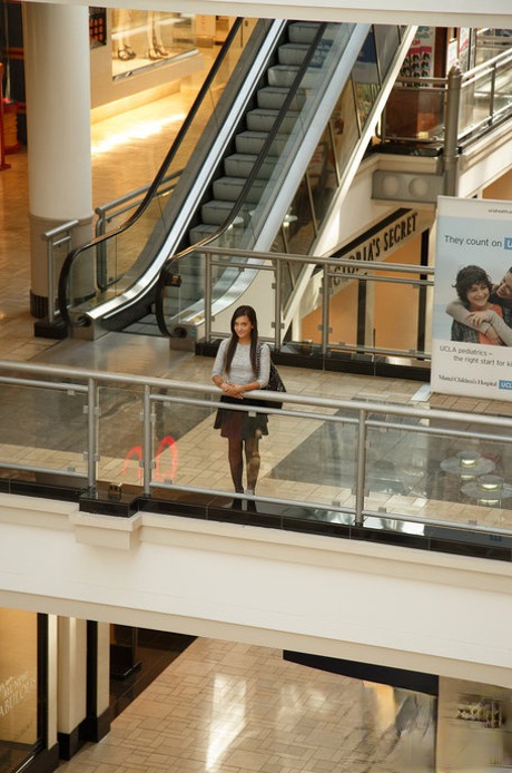 Petite teen Gia Paige flashes tiny tits & tight ass while posing at the mall