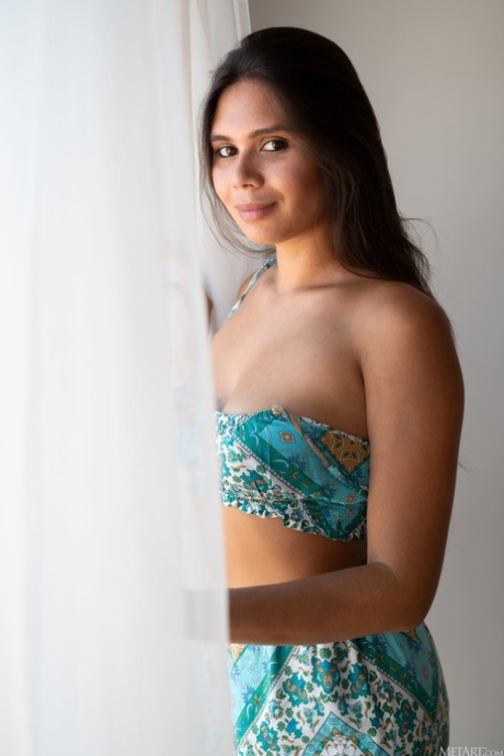 Beautiful teen Savana undresses and shows her juicy tits and big ass