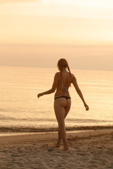 Amateur beauty Ulyana Orsk teasing with her spectacular booty on the beach