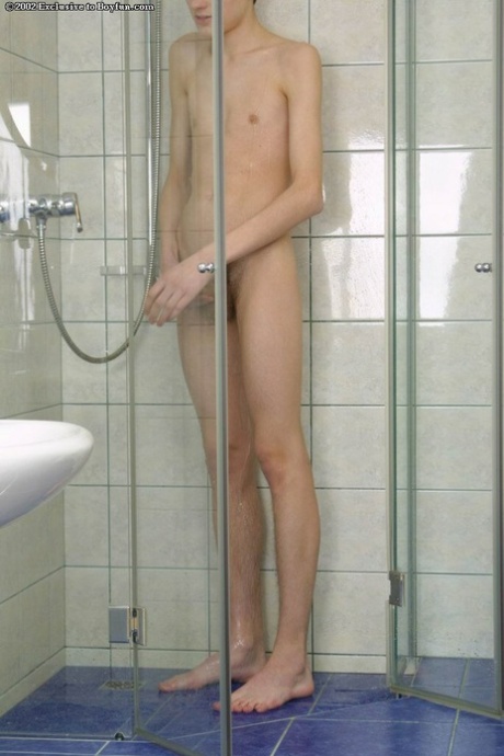 Skinny twink Sergey Voituk plays with his small dick in the bathroom