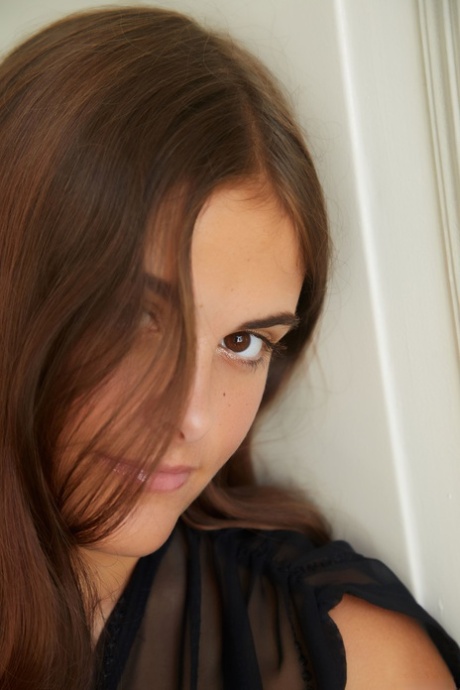 Glamorous brunette teen Minnie strips & shows her big booty with tan lines