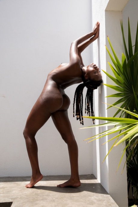 Sweet ebony teen Dakota Simone shows her round ass and tasty cunt