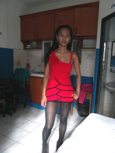 Tiny Filipina Trisha Mae strips to her stockings and spreads her pussy