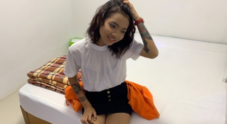 Cute amateur slut Emelyn stripping and exposing her inked body in a solo