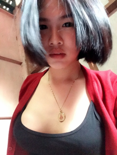Pretty Asian shemale Gogo posing topless and in hot outfits in sexy selfies