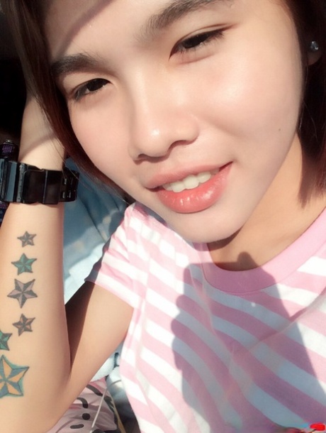Pretty Asian shemale Gogo posing topless and in hot outfits in sexy selfies