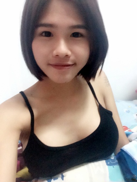 Pretty Asian shemale Gogo posing topless and in hot outfits in sexy selfies
