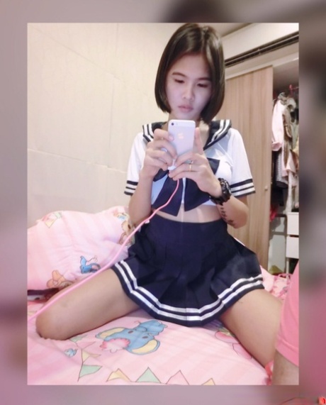 Pretty Asian shemale Gogo posing topless and in hot outfits in sexy selfies