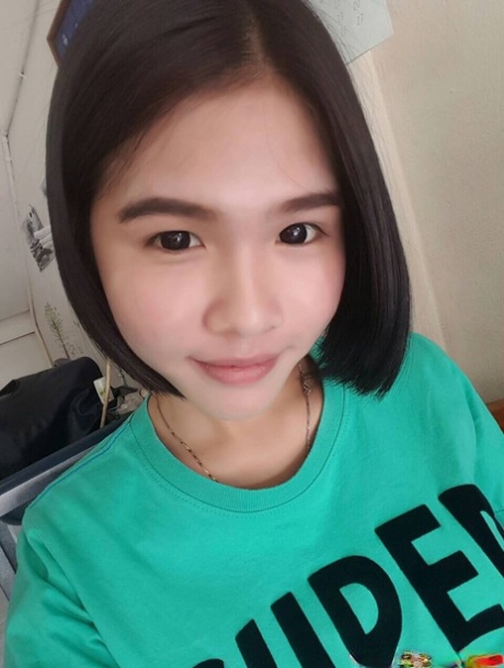 Pretty Asian shemale Gogo posing topless and in hot outfits in sexy selfies