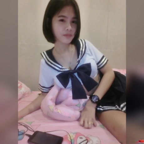 Pretty Asian shemale Gogo posing topless and in hot outfits in sexy selfies