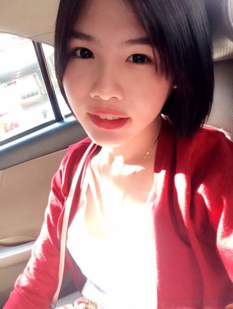 Pretty Asian shemale Gogo posing topless and in hot outfits in sexy selfies