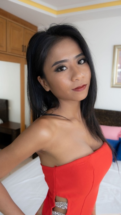 Petite babe Som takes off her sexy outfit & shows her protruding labia