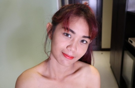 Pretty Asian babe Banjy shows off her petite naked body & her hairy cunt