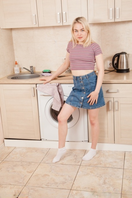 Cute Caucasian babe Maya Stone undressing and masturbating in the kitchen