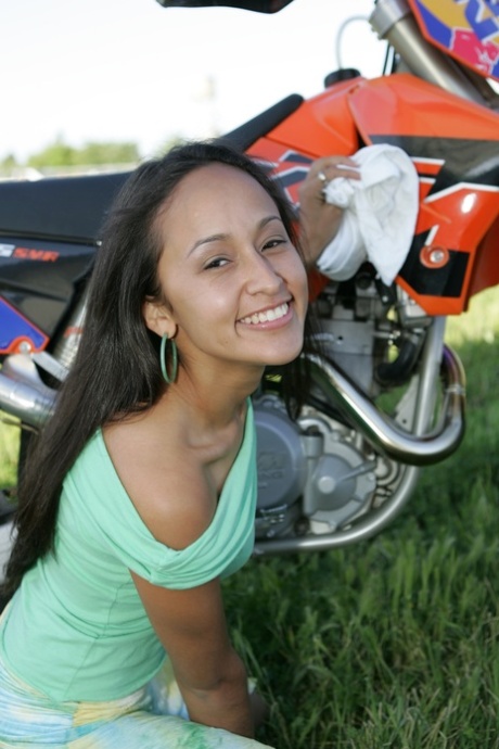 Breathtaking Latina Pamy posing for outdoors for a motorcycle magazine