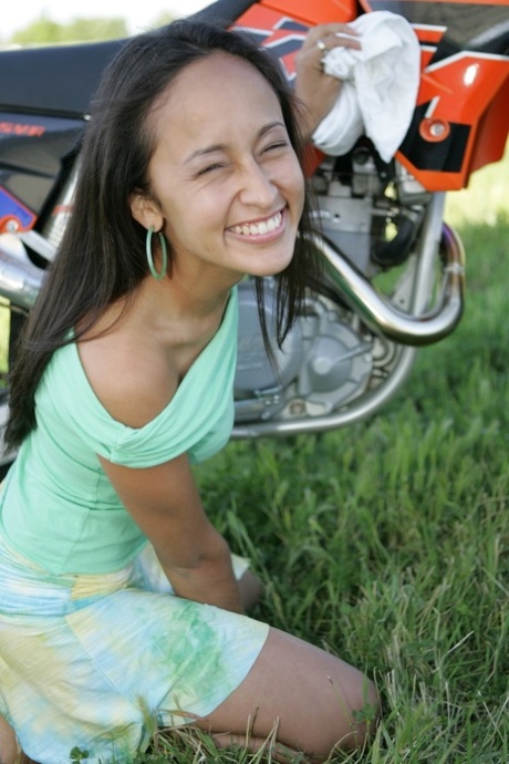 Breathtaking Latina Pamy posing for outdoors for a motorcycle magazine