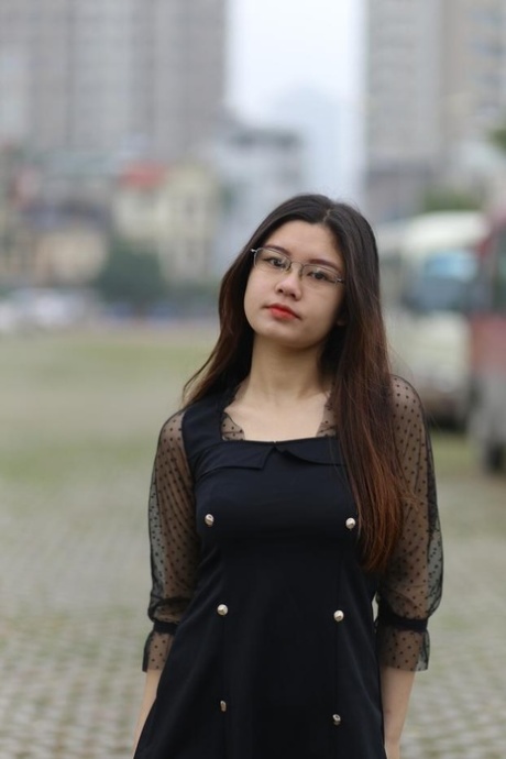 Pretty Asian model Natalia posing in her lovely black outfit outdoors