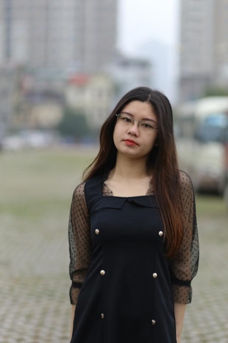Pretty Asian model Natalia posing in her lovely black outfit outdoors