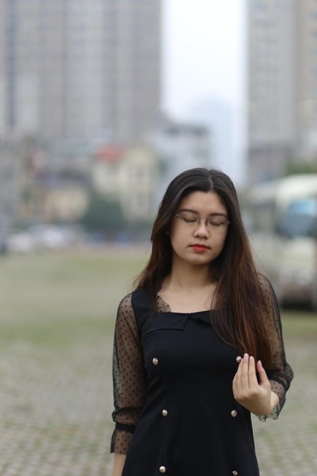 Pretty Asian model Natalia posing in her lovely black outfit outdoors