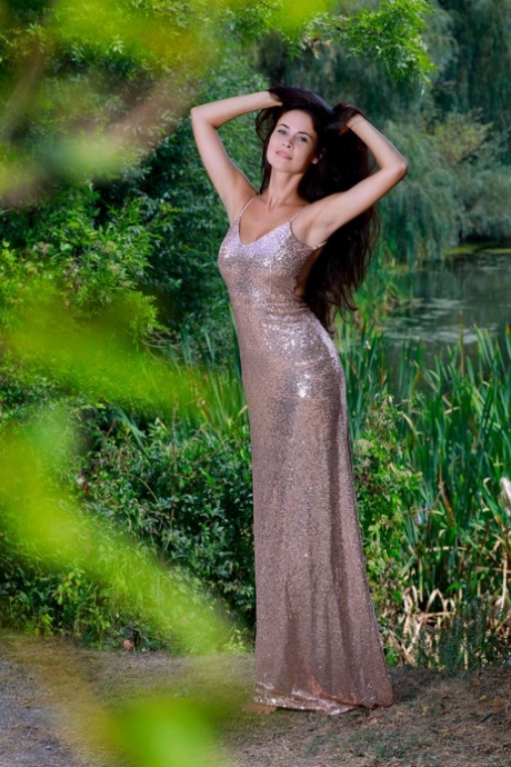 Teen Martina Mink strips her sexy dress & shows her tits & pussy by the river