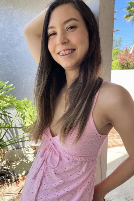 Sexy brunette Amber Angel shows her irresistible shaved pussy up close