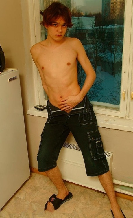 Good-looking twink unveils his small dick in a hot striptease after smoking