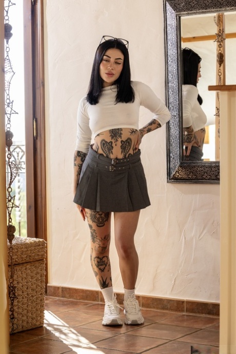 Tattooed teen Tabatha Lust strips and plays with her beaver in a solo