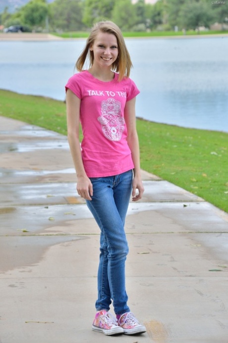 Sweet skinny teen Catarina unveils her tiny tits and tasty clam at the park