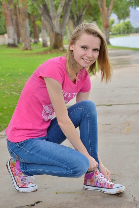 Sweet skinny teen Catarina unveils her tiny tits and tasty clam at the park