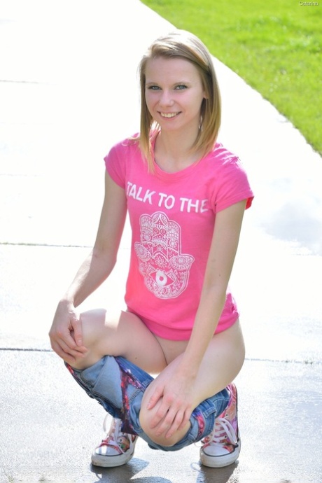 Sweet skinny teen Catarina unveils her tiny tits and tasty clam at the park