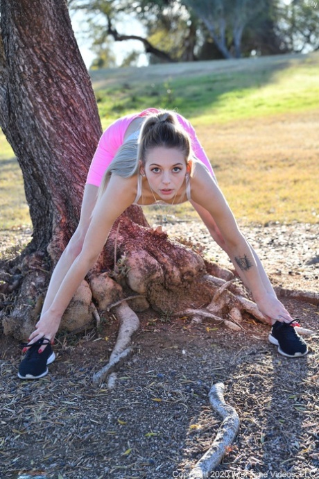 Adorable teen Lily reveals her slim body outdoors and toys herself indoors